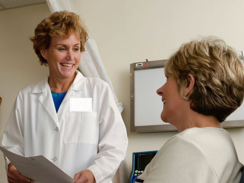 Doctor and patient in a warm consultation — always consult your healthcare provider before making decisions about prescription medications or dietary supplements